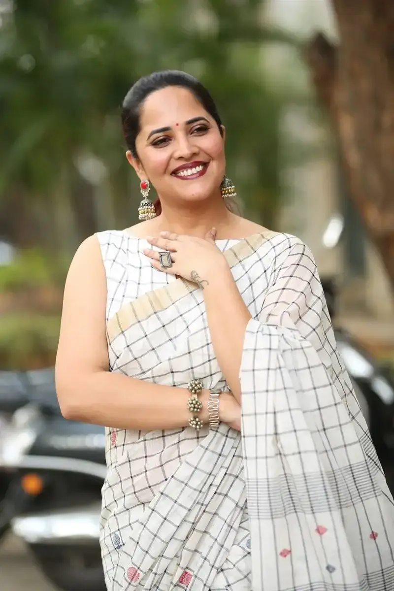 Anasuya Bharadwaj in White Saree at Razakar Movie Launch